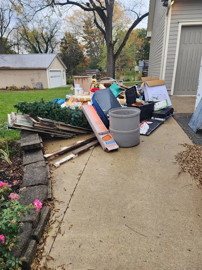 Dumpster being loaded with debris for Estate Cleanout Dumpster Rental in Johnstown